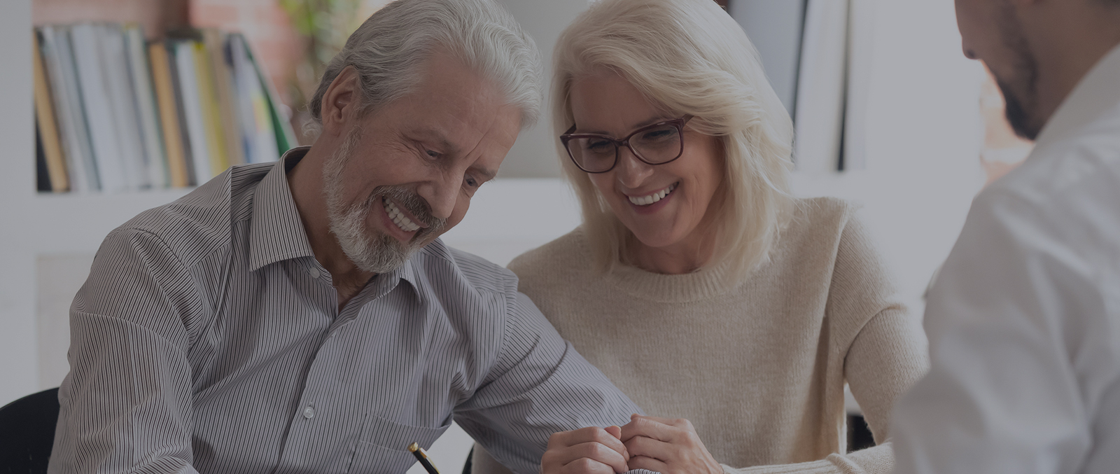 Elder Couple is signing papers